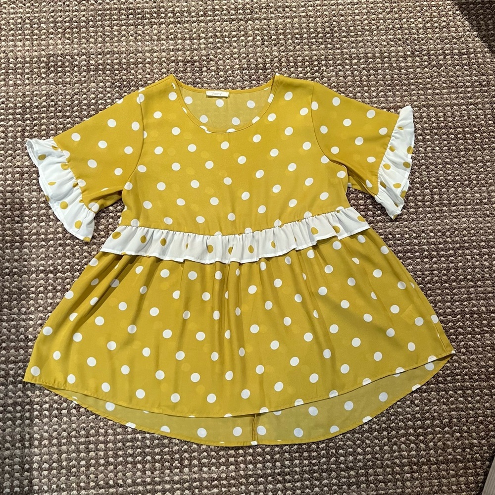 Yellow top with white polka dots and white ruffle sleeves